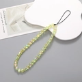 Colorful iridescent heart-shaped beaded phone charm wrist strap in a gradient yellow-green - Mermaid Yellow