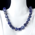 Natural dark blue faceted stone bead necklace with white spots on model mannequin - Blue Sodalite