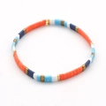 Bracelet Tila bohème en perles de verre colorées avec des accents orange et bleus - Orange/Bleu/Blanc/Or Mélangé