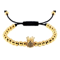 Adjustable gold beaded bracelet featuring a crown charm with black micro zircon stones - Gold