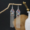 Macro detail of Bohemian tassel earrings with colorful beads on a natural branch - Silver Colorful Beaded Extra Long Tassel Style (E6130-1)