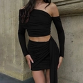 Detail of black off-shoulder long sleeve top and ruched mini skirt with side drapes - S / Black
