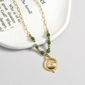 Französische Vintage-Halskette aus Titanstahl mit 14K Gold Evil Eye Anhänger und grünen Perlen - Grünperlen Zirkonia Teufelsauge Anhänger Halskette