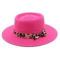 Detail of pink straw sun hat featuring a stylish leopard print ribbon and bow decoration - M (56-58cm) / Rose Red