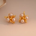 Close-up of gold fireworks coral stud earrings with inlaid pink pearls and zircons - 44# Coral Pearl Gold (44# Silver Pin-Gold-Flower)