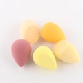 Set of 5 teardrop makeup sponges with flat edge in warm colors on a white background - 5-Piece Yellow Series Set (With Slant-cut)