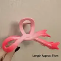Pink gradient bow hair claw clip for thick hair, 11cm length shown in hand - Gradient Fishtail Pink-11cm