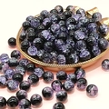 Macro shot of 10mm black and purple cracked glass beads for DIY jewelry making - Dark Purple
