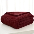 Dark red Nordic knitted blanket with tassel details and thick waffle texture - Burgundy