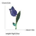 Elegante spilla a tulipano con cristalli blu e verdi in una finitura dorata - Blu