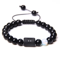 Adjustable black bead bracelet featuring Gemini zodiac symbol and moonstone accent - Gemini