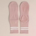 Close-up of pink yoga socks with white stripes and non-slip grippy dots on the sole - One Size / Pink