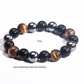 Bracelet de perles en œil de tigre et obsidienne avec circonférence de 19cm et détails - 12mm Œil de Tigre Noir Brillant Hématite