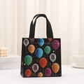 Small black non-woven gift bag with colorful balloon prints and star patterns - Balloons & Stars