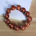 Single strand Argentine Green Sandalwood bracelet featuring polished tiger stripe wood beads - 10mm 19 Beads / Red Sandalwood Straight Grain