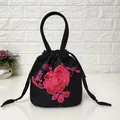 Detail of red peony embroidery on black satin drawstring bucket bag with handle - Camellia