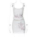 Detail of white two-piece set featuring pink rhinestone floral patterns on fabric - S / White