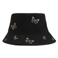 Close-up showing the intricate colorful butterfly embroidery on a black bucket hat - Black