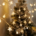 Outdoor LED star and globe string lights emitting warm white glow for camping - Crystal + Stars (warm Colors) / 1.5m 10LED Battery