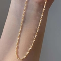Minimalist gold twisted water wave chain necklace shown on neck with elegant texture - Gold Water Ripple Chain (40+5cm)