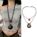 Detail of bohemian wax cord necklace featuring hollow metal flower and wood pendants - Vintage Ethnic Wood Ring Style (11#)