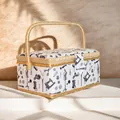 Floral sewing basket with tool patterns, woven handle, and secure flap closure - A Style - White Sewing Theme
