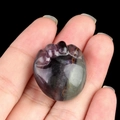 Handheld purple and green natural fluorite crystal stone carved in a cute paw shape - Fluorite