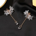 Elegant floral tassel earrings with multilayered white petals and gold chain drops - Flower Crystal Style (0956)