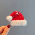 Handcrafted red knit Christmas hat hair clip with a silver snowflake charm detail - Flat Santa Hat Clip