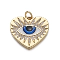 Macro shot of gold heart pendant with blue evil eye enamel and pavé crystals - Sunburst Heart Evil Eye