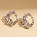 Detailed macro shot of silver earrings with irregular molten metal texture and high gloss - Silver (Silver Pin) / Silver