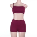Detailed close-up of dark burgundy high-elastic knit fabric on activewear set - S / Burgundy