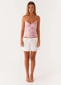 Detailed view of pink floral embroidery and delicate beadwork on a summer camisole top - M / Pink
