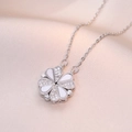 Macro detail of silver clover necklace with heart-shaped white shell petals and crystals - Steel Color Mother of Pearl Style (X1205)