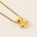 Polished golden necklace with smooth bubble-style number 2 pendant on beige background - Letter Z
