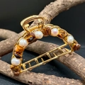 Macro shot of gold metal hair claw clip with natural amethyst stones and pearls - Tiger Eye + Deep Sea Pearl Gold Hair Claw