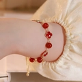 Red agate beaded bracelet featuring golden clover charms and adjustable metal chain - Red Agate Clover Bracelet / Gold-Red