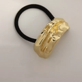 Minimalist elastic hair tie featuring a textured gold pleated metal ornament - Double Row Embossed Pattern Gold