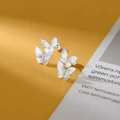 Chic silver butterfly stud earrings with engraved details on bright yellow background - Double Butterfly Overlaid Design (A73)