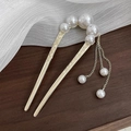 Gold U-shaped hair pin with white pearls, floral engraving and pearl tassels on wood - Gold Pearl Tassel Hairpin