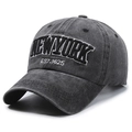 Washed charcoal grey baseball cap with New York embroidery in a 45-degree side view - One Size Adjustable / Black