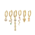 Macro shot of six gold-plated earrings with star, moon, and zircon stone charms - Snake Geometric Colorful Zircon 6-Piece Set