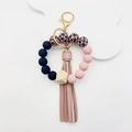 Siliconen kralen armband sleutelhanger met luipaardprint, houten kraal en kwast - Roze Luipaard