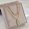 Double-layered gold necklace with colorful beads and light green oval gem pendant - Gold/Light Green