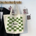 Close-up of cream canvas tote bag with green checkerboard pattern and Boom lettering - BOOM (Green Checkerboard)