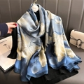 Blue and grey large floral print silk scarf displayed on black clothing drape - Blue Floral / 180*90