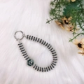 Beaded phone charm with black and silver beads and a sparkling green rhinestone ball - Green Rhinestone Ball Pendant