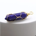 Dark blue stone pendant with natural texture wrapped in gold wire with a top loop - Lapis Lazuli