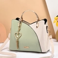 Women's light green and beige contrast handbag with gold metal handle and pearl tassel - Green and White