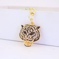 Sparkling tiger head keychain with crystal rhinestones and golden lobster clasp - Gold